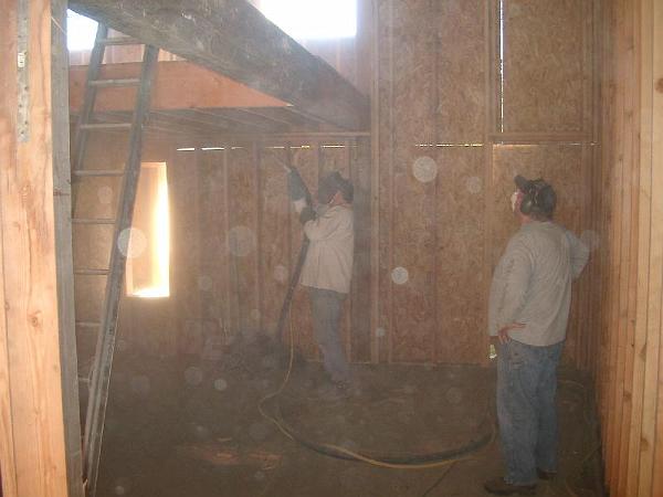 sandblasting the beams.JPG - Sandblasting the recycled glulam in the master suite.